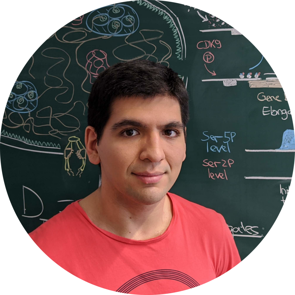 Portrait of Omar Munoz wearing a red shirt before a blackboard